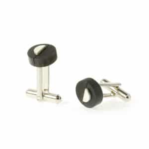 Black circular cufflinks with a half circle of silver on top